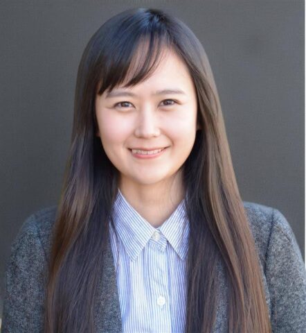 Euna Jo, certified public accountant at Good Agriculture, smiling in a button up shirt and jacket