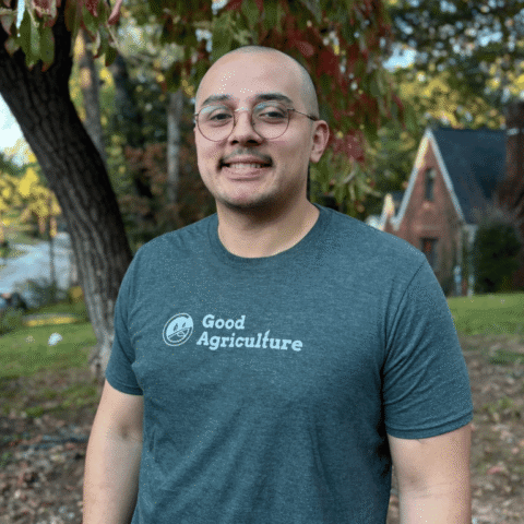 Allen Osorio, Farm Finance Manager at Good Agriculture, smiling in a Good Agriculture shirt