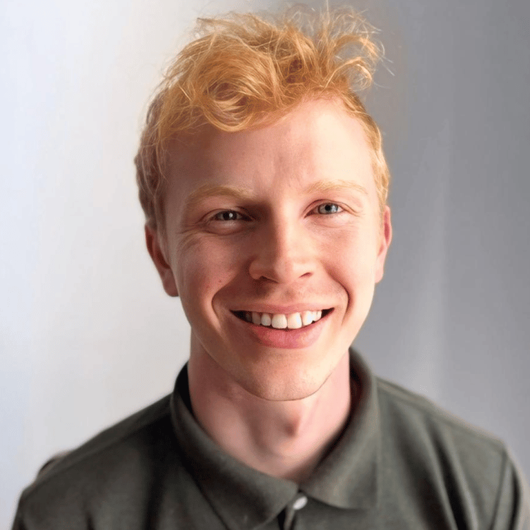 Joseph Walker, Farm Finance Analyst at Good Agriculture, smiling with a white background.